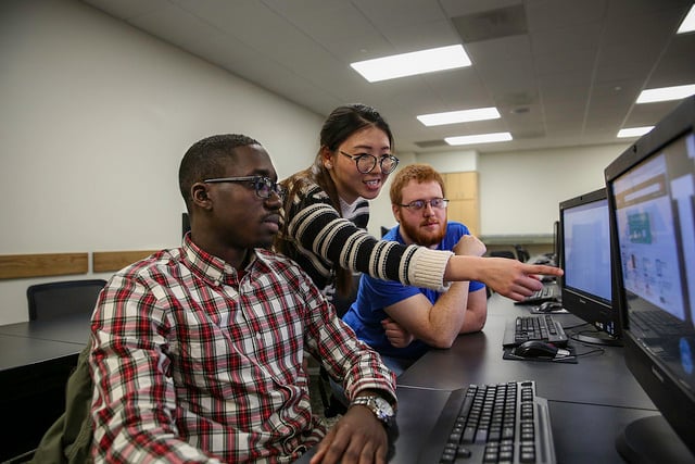 Three students at computers